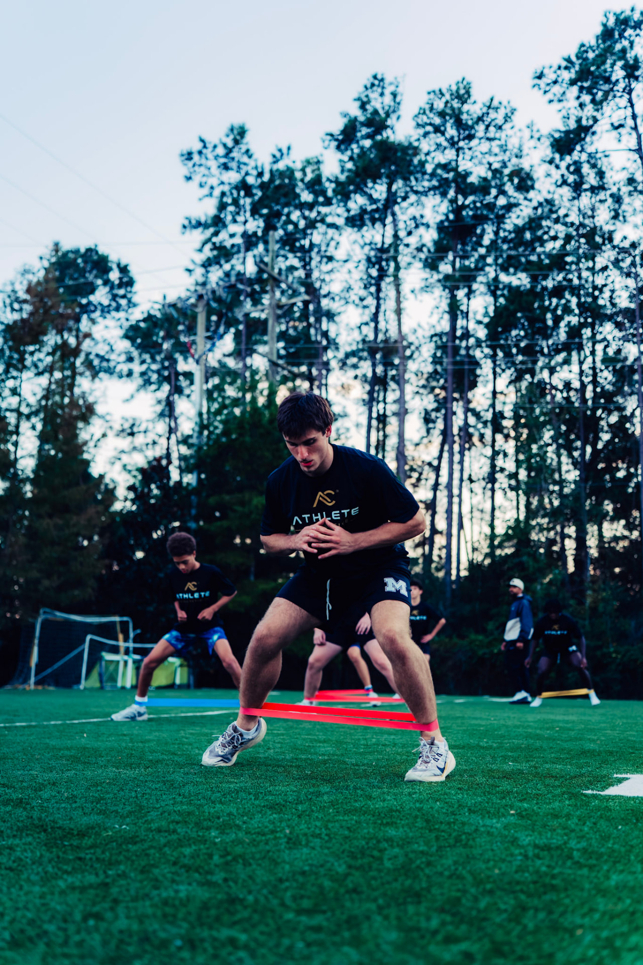 Athlete practicing acceleration on the outdoor turf